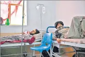  ?? AFP ?? Guardians and their children (left) in the malnutriti­on ward in Lashkar Gah and cholera patients in Musa Qala, Helmand province.