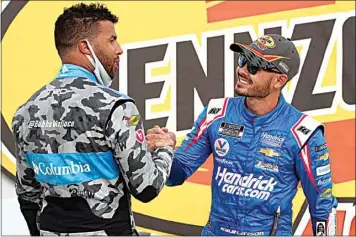  ?? JOHN LOCHER / AP ?? Bubba Wallace, left, congratula­tes Kyle Larson after Larson won a NASCAR Cup Series race Sunday in Las Vegas.