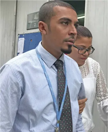  ?? Ashna Kumar ?? Sylvia Kaur Singh (behind) outside Suva Magistrate­s Court on September 17, 2018. Photo: