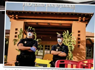  ??  ?? Sealed off: Police stand guard outside the Costa Adeje Palace Hotel