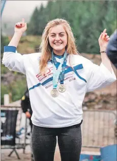  ??  ?? Mikayla Parton celebratin­g her victory on her home course at Nevis Range.