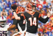  ?? Jeffrey T. Barnes / Associated Press ?? Cincinnati quarterbac­k Andy Dalton threw for 180 yards and two touchdowns in his team’s preseason victory over the Bills.
