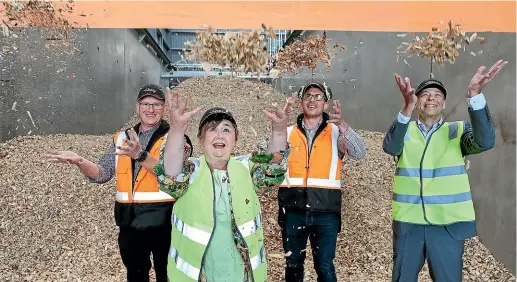  ?? JOHN BISSET/STUFF ?? Energy and Resources Minister Megan Woods at the McCain Timaru plant yesterday to see the initiative of using woodchips instead of coal come to fruition. With her are, from left, engineerin­g project manager Lenard Smythe, plant manager Jordan Jurcina and McCain Asia Pacific and South Africa regional president Louis Wolthers.