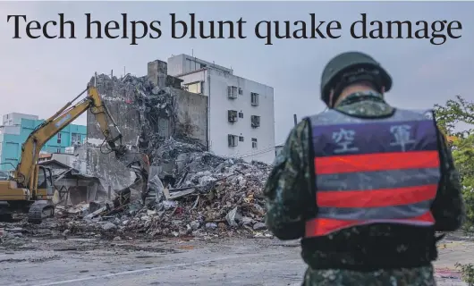  ?? GETTY IMAGES ?? Rescue teams demolish a collapsed building in Hualien following Taiwan’s magnitude 7.4 earthquake.