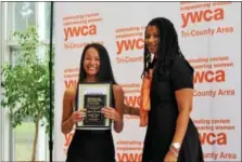  ??  ?? Gabrielle Beauvais, of Exeter, holds her Rising Star award while posing for a photo next to YWCA Director of Program Developmen­t Sheri McDonald. Several girls throughout the state and even on from Maryland were honored during the first Tribute to...