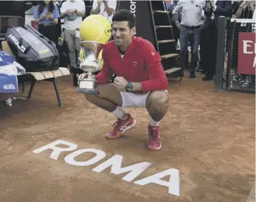  ?? ?? 0 Serbia’s Novak Djokovic poses with the trophy after beating Stefanos Tsitsipas of Greece