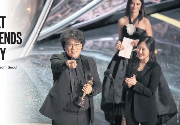  ??  ?? Bong Joon-ho receives the award for best internatio­nal feature film for
Parasite, at the Academy Awards in Los Angeles.