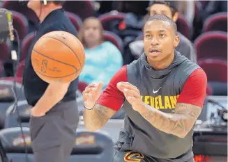  ?? TONY DEJAK/ASSOCIATED PRESS ?? Cleveland’s Isaiah Thomas catches a pass during warmups before a Cavaliers game earlier this season. Thomas is expected to see his first action tonight since being traded from Boston last summer.