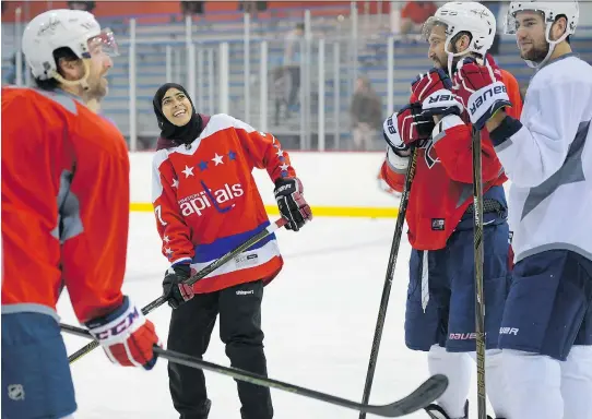  ?? PHOTOS: JOHN MCDONNELL/ WASHINGTON POST ?? United Arab Emirates women's hockey player Fatima Al Ali took to the ice with Washington Capitals players from left, Justin Williams, Alex Ovechkin, and Tom Wilson recently after the Capitals organizati­on caught wind of a viral video of Al Ali...