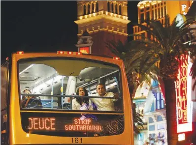  ?? STEVE MARCUS (2013) ?? Passengers ride “The Deuce,” a double-decker bus, on the Strip. Ridership on buses operated by the Regional Transporta­tion Commission of Southern Nevada has fallen off since the introducti­on of ride-hailing services such as Lyft and Uber.