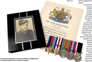  ??  ?? A family photograph of Jack Crawford, alongside his commemorat­ive scroll and war medals.