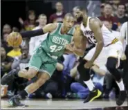  ?? TONY DEJAK - THE ASSOCIATER­D PRESS ?? Boston Celtics’ Al Horford (42) drives on Cleveland Cavaliers’ Tristan Thompson (13) during the second half of Game 4 of the NBA basketball Eastern Conference finals, Tuesday, in Cleveland.