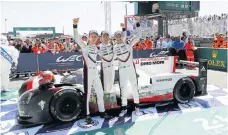  ??  ?? L-R: Brendon Hartley, Timo Bernhard and Earl Bamber celebrate their overall and class victory at Le Mans.