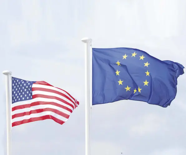  ??  ?? U.S. and European Union flags wave during a preview day for the 2019 Solheim Cup at Gleneagles Golf Club, Auchterard­er, Scotland, Sept. 10, 2019.