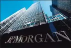  ?? Getty Images file photo ?? JPMorgan Chase reported higher third-quarter earnings on Tuesday behind strength in investment banking, avoiding new reserves for bad loans that have plagued the last two quarters.