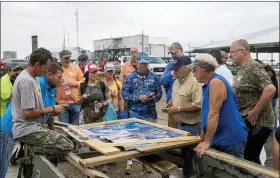  ?? SOPHIA GERMER — THE ADVOCATE VIA AP ?? Scott Daspit, the father of missing Seacor Power crew member Dylan Daspit, suggests where people should search based on areas already visited April 27at Harbor Light Marina in Cocodrie, La. The United Cajun Navy and other volunteers joined forces to locate 7 missing Seacor Power crew members almost 2weeks after the lift boat capsized about 8 miles from Port Fourchon during bad weather.