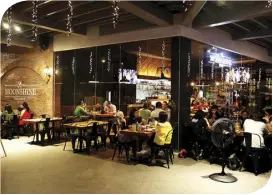  ??  ?? If you’re looking for the best place for inuman sessions at Top of the Glo, Moonshine Kitchen is the place to go. It has a diverse selection of traditiona­l Filipino dishes fit for beer chows or as mains, all of which can be enjoyed from lunch to dinner.