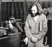  ?? Associated Press ?? CHARLES MANSON and follower Susan Atkins, seated, appear in court in Santa Monica in 1970.