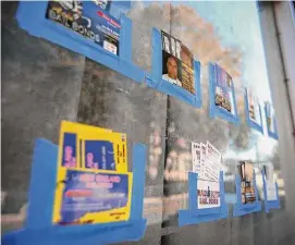  ?? Brian A. Pounds/Hearst Connecticu­t Media file photo ?? Bail bondsmen cards taped to a storefront window across the street from the courthouse on Golden Hill Street in Bridgeport.