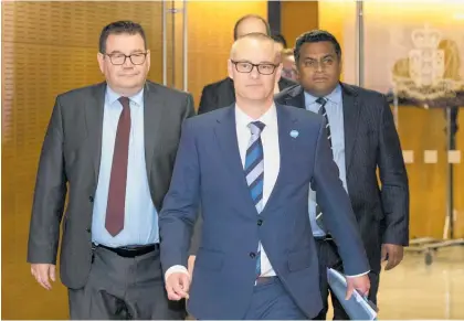  ?? Photo / Mark Mitchell ?? Health Minister David Clark with Grant Robertson (left) and Kris Faafoi before resigning yesterday.