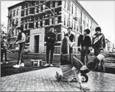  ?? CHICAGO TRIBUNE ?? Members of the “Floor Masters” do the head spins and pop-locks of break dancing in 1984.