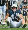  ?? BARRY REEGER/AP PHOTOS ?? Penn State tight end Tyler Warren enjoys his 2-yard touchdown catch in the second quarter of the Nittany Lions’ 63-7 win over Delaware on Saturday at Beaver Stadium.