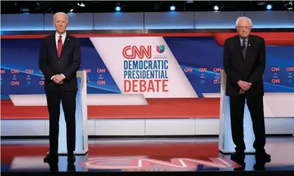  ??  ?? Joe Biden and Bernie Sanders at the debate. Photograph: CNN/Rex/Shuttersto­ck