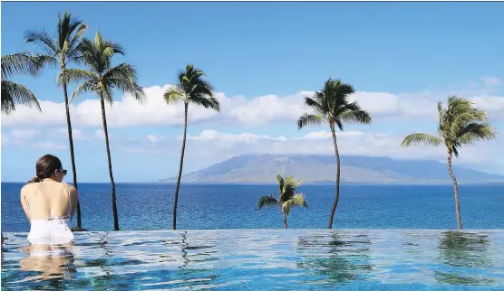  ??  ?? An afternoon at the adults-only infinity-pool at Four Seasons Resort Maui is a wonderful way to end a day of sightseein­g.