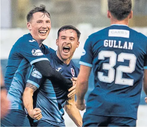  ??  ?? DOUBLE TROUBLE: Raith’s Lewis Vaughan is mobbed after notching his second goal in Rovers’ 5-1 win over the Pars at Stark’s Park at the end of March.