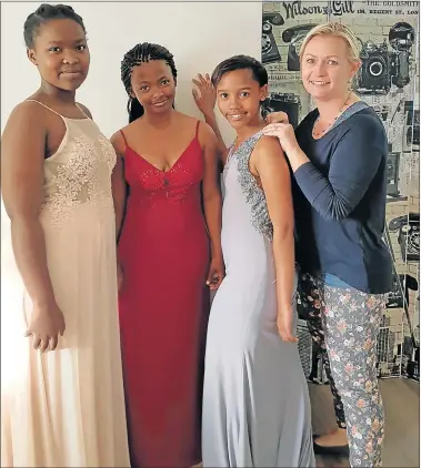  ??  ?? FINAL FITTING:From left Nonelele April, Sinazo Kunene and Vivica Twecu with Leandre Fourie before the matric dance