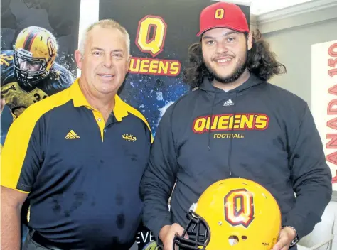  ?? BERND FRANKE/POSTMEDIA NEWS ?? Queen's University head football coach Pat Sheahan, left, and one of his newest recruits, A.N. Myer Secondary School student athlete Noah Spadafora.