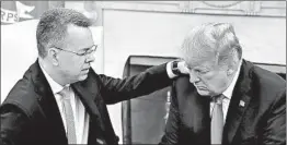  ?? MARK WILSON/GETTY ?? Andrew Brunson kneels in prayer with President Trump in the Oval Office on Saturday.