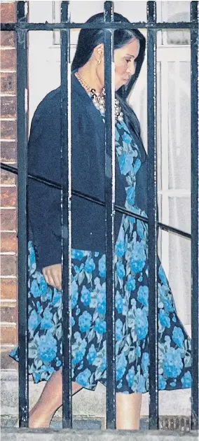  ??  ?? Priti Patel arriving at the rear of Downing Street last night to meet Mrs May