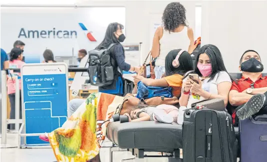  ?? AFP ?? American Airlines had to fiddle with its ticket terms twice last month, revising a revision that made it seem the airline would leave passengers stranded after canceled flights or missed connection­s.