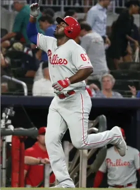  ?? JOHN BAZEMORE — THE ASSOCIATED PRESS ?? The Phillies’ Jose Pirela gestures as he runs the bases after hitting a three-run home run during the fourth inning Tuesday in Atlanta.