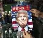  ?? JOHANNES EISELE/AFP ?? A copy of a Chinese magazine in Shanghai with a picture of president-elect Donald Trump on the cover in a Shanghai newstand.