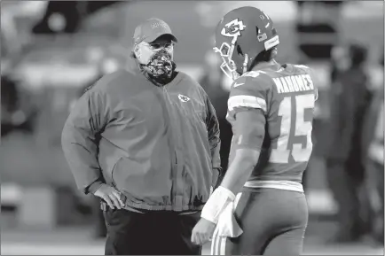  ?? Jamie Squire / Getty Images /TNS ?? Kansas City Chiefs quarterbac­k Patrick Mahomes (15) speaks with head coach Andy Reid prior to a game against the Denver Broncos at Arrowhead Stadium on Dec. 6 in Kansas City, Missouri.