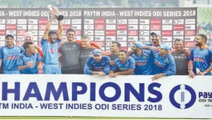  ?? Agence France-presse ?? The Indian cricket team celebrate with the trophy after beating the West Indies in their last and Thiruvanan­thapuram on Thursday. fifth ODI match in