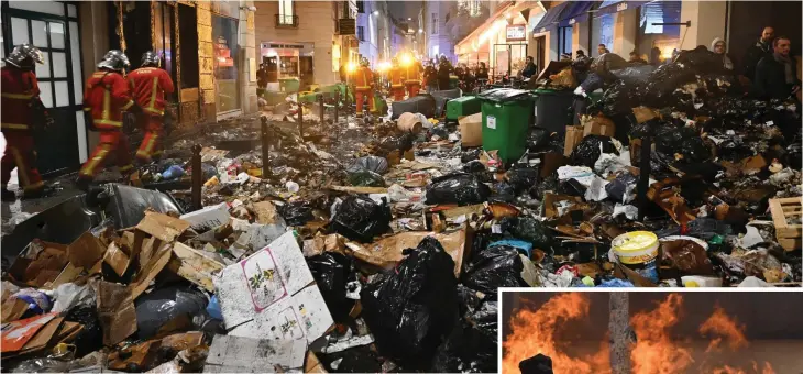  ?? ?? Street chaos: Firefighte­rs check uncollecte­d rubbish in Paris after extinguish­ing a blaze during a protest
