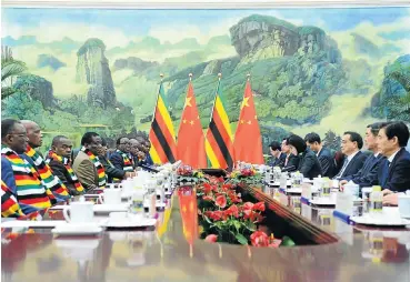  ?? Picture: Reuters ?? Zimbabwe’s President Emmerson Mnangagwa, fourth from left, leads a delegation to meet Chinese Premier Li Keqiang, third from right, at the Great Hall of the People in Beijing on Wednesday.