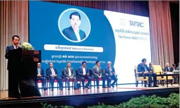  ?? HENG CHIVOAN ?? TAFTAC president Kong Sang (left) addresses the 2023 Tax Forum held in Phnom Penh in December.