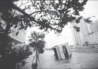  ??  ?? A truck is seen turned over in Miami. (Reuters: Carlos Barria)