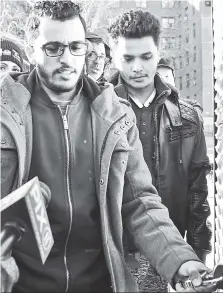  ??  ?? SHOCKING: Relatives and coworkers (left) of Abdulla Yafaee (right) are sickened over the death of the 80-year-old bodega man, who was shot inside 797 Deli in Brooklyn by a customer who was denied a beer because he was 50 cents short.