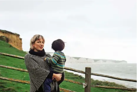  ??  ?? Lucy Corkhill and her son outside their off-grid cottage.