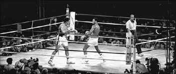  ?? LAS VEGAS NEWS BUREAU ?? Muhammad Ali, left, fights Larry Holmes on Oct. 2, 1980, at Caesars Palace. Inside and outside the ring, Ali commanded an audience. Everyone listened. Crowds couldn’t bear not to listen, even when his greatness had obviously faded and the words that...