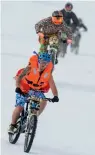  ?? — AP ?? Cyclists ride their bikes on the ski slopes during the 29th edition of the GP St- Sylvestre in Switzerlan­d on Sunday.