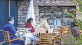  ?? Chase Stevens Las Vegas Review-Journal@csstevensp­hoto ?? People dine outdoors last week at Vintner Grill in Summerlin.