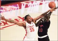  ?? Eric Christian Smith / Associated Press ?? SMU forward Yor Anei, right, shoots as Houston forward Brison Gresham defends Sunday.