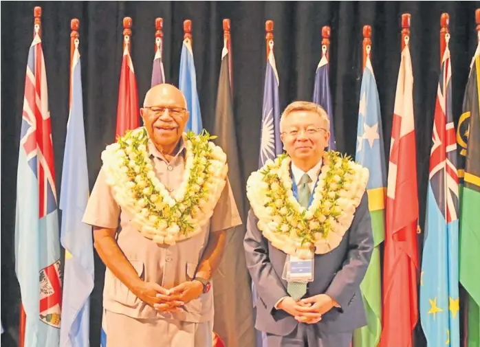  ?? Picture: RNZ/FIJI GOVERNMENT FACEBOOK PAGE ?? Fiji Prime Minister Sitiveni Rabuka, pictured here with IMF senior official Bo Li, became the latest Pacific leader to endorse the idea of Pacific-wide visa-free travel at a public address to an IMF-hosted gathering in Fiji last month.