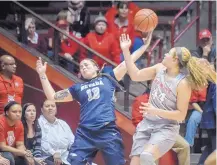  ?? ROBERTO E. ROSALES/JOURNAL ?? UNM’s Jaisa Nunn, right, looks to grab a loose ball away from Nevada’s TMoe on Saturday.